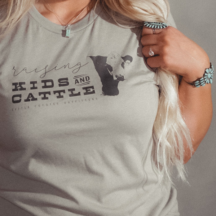 “Raising Kids and Cattle” Adult Unisex Western Graphic Tee in Stone