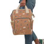 Load image into Gallery viewer, Cow Dogs Diaper Bag in Tan
