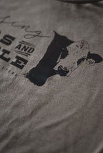 Load image into Gallery viewer, “Raising Kids and Cattle” Adult Unisex Western Graphic Tee in Stone
