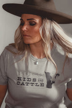 Load image into Gallery viewer, “Raising Kids and Cattle” Adult Unisex Western Graphic Tee in Stone
